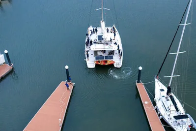 Catamaran approaching a dock, from the published excursion brochure