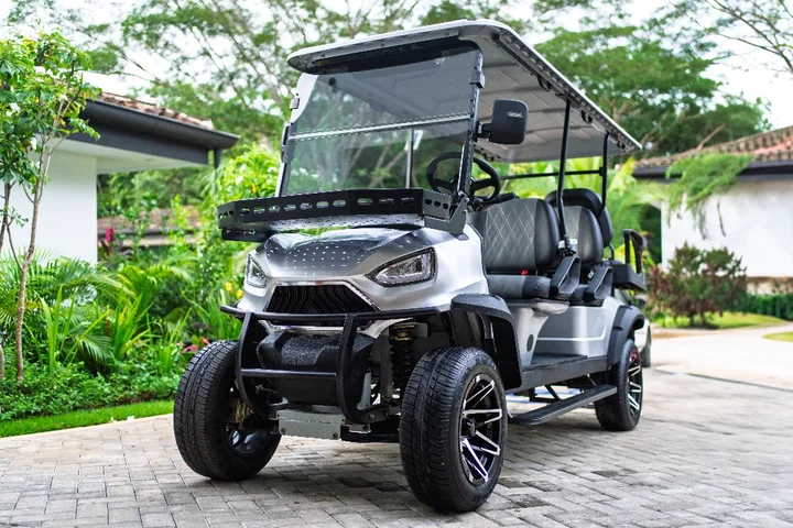 Golf cart on a tree-lined road in Costa Rica