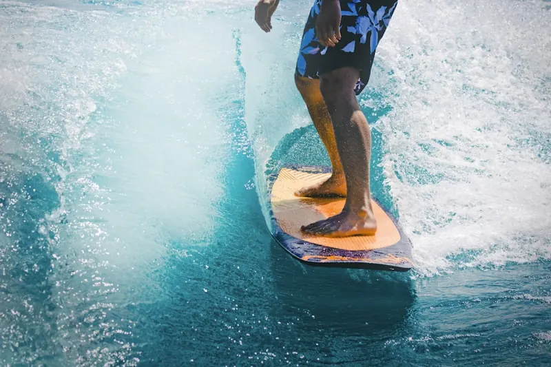 A surfer riding a breaking wave