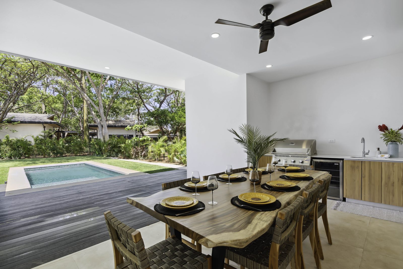 Covered dining pavilion and private pool at an Entroterra home