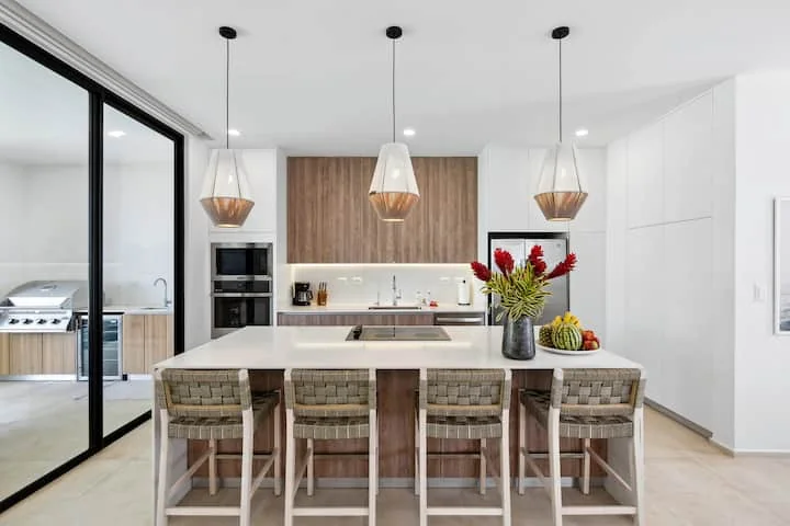 Bright kitchen and island seating at Casa #6