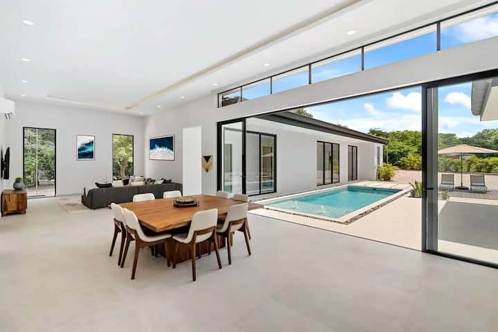 Open-plan dining area beside the private pool at Paradiso